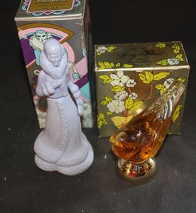 lot 378 image: two Avon decanter bottles with labels. Milk glass women glass bird designee
