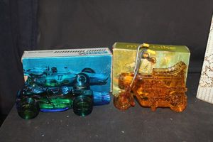lot 380 image: Two Avon decanter bottles, amber motorcycle and blue bike with boxes