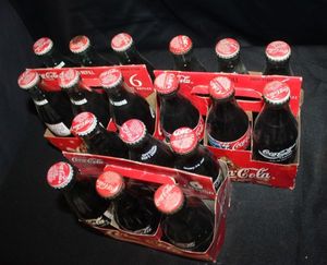 lot 502 image: Three Six Packs of Collectable Coke Bottles