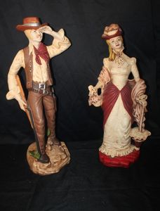 lot 505 image: Approxiately 2 feet Tall Figurines of Cowboy and Victorian style dressed Lady