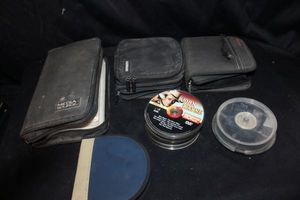 lot 560 image: Very Large Selection and Variety of DVDs and CDs in Carriers as well as loose, all cases are full