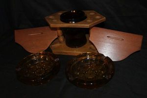 lot 572 image: Vintage Wooden Pipe stand  Holder with Amber Glass Jar Humidor, Two Vintage Amber Ashtrays and Two Small Wooden Wall shelves