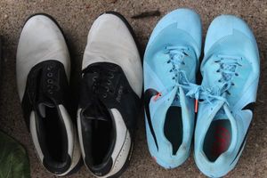 lot 582 image: Black and white golf shoes size 10M, Womens Nike Track and Field shoes.