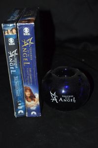 lot 622 image: Touched By an Angel VHS Tapes and Candle Holder