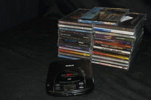 lot 625 image: Selection of CDs still Factory Sealed, and a Portable CD player