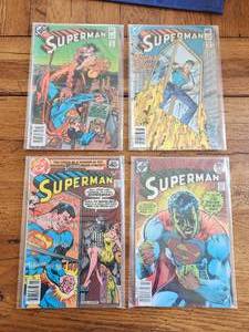 lot 29 image: Selection of vintage DC Comics - Superman #382,383-1983, #331-1979, #317-1977