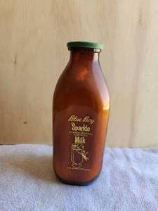 lot 7 image: Vintage square quart milk glass milk bottle - brown - blue Boy - has rare Hillside milk cap