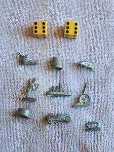 lot 42 image: Selection of vintage Monopoly board pieces and dice