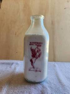 lot 106 image: Vintage square glass milk bottle - Coleman Milk - Annie Oakley -