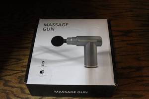 lot 100 image: percussive massage gun for deep tissue muscle therapy.NIB