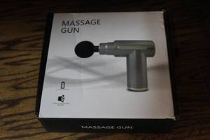 lot 101 image: percussive massage gun for deep tissue muscle therapy. NIB