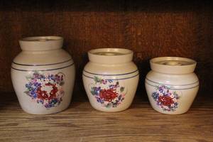 lot 105 image: set of vintage stoneware canisters featuring a hand-painted floral design