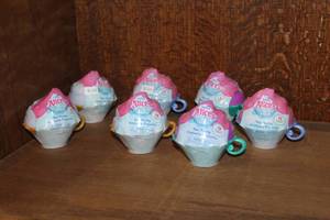 lot 15 image: Disney Junior Alices Wonderland Bakery Tea Party Mystery Capsules.