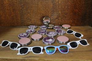 lot 24 image: Compact mirrors and kids sunglasses