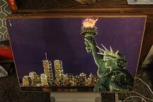 lot 204 image: Light-up Crystal Canvas wall art piece featuring the New York City skyline and the Statue of Liberty.