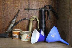 lot 211 image: grease guns, and funnels.and more see pictures for details