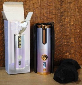 lot 217 image: portable cordless automatic hair curler used for styling hair without tangling wires opened for pictures