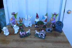 lot 74 image: items are miniature garden collectibles, such as figurines of fairies, gnomes, bunnies, and decorative structures