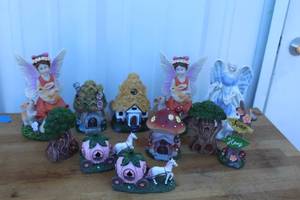 lot 76 image: fairy garden miniatures featuring fairy figurines, small houses, and more see pictures for details