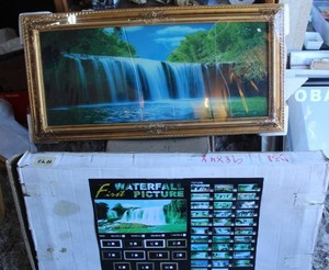 lot 89 image: vintage-style electric motion wall hanging featuring a scenic picture