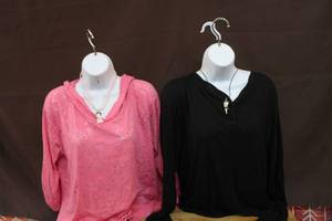 lot 240 image: 2- hanging mannequins with tops and necklaces