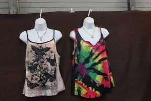 lot 242 image: 2- hanging mannequins with tops and necklaces