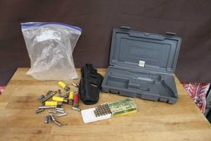 lot 244 image: Mix of bullets and a ruger case  and a hip holster