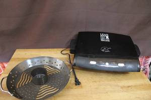 lot 261 image: George Foreman Lean Mean Fat Grilling Machine and Vertical Roasting Wok by Charcoal Companion, typically used for cooking chicken vertically on a grill or in an oven