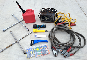 lot 21 image: Automotive tools & supplies, Sears battery charger, jumper cables, 1 gallon gas can & more