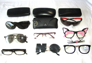lot 82 image: Assorted sun glasses and reading glasses plus cases