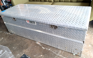 lot 179 image: Tractor Supply Co. diamond plate aluminum truck bed storage box 19.5 x 61 x 24.5