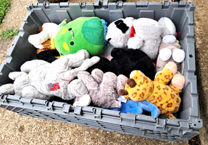 lot 183 image: Double lid storage tote full of stuffed animals