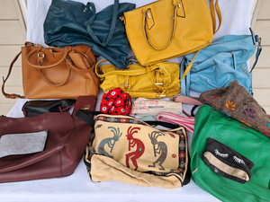 lot 139 image: Assorted purses, wallets, clutches as shown