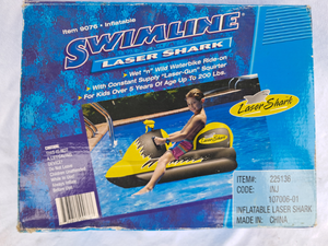 lot 118 image: Swimline laser shark water bike ride-on inflatable