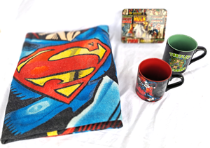 lot 105 image: Superman throw blanket, Ninja Turtle and Joker cups, Marvel Avengers tin