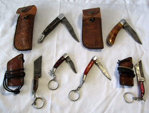 lot 96 image: NEW genuine Damascus steel blade pocket and mini lanyard keychain knives with leather sheaths (Bid is times the quantity)