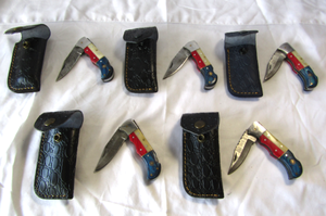 lot 97 image: NEW genuine Damascus steel blade Texas theme folding pocket knives with leather sheaths (Bid is times the quantity)