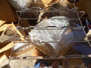 lot 84 image: Plastic displays for bottles
