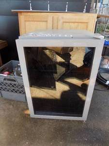 lot 31 image: Frigidaire mini fridge interior glass is broken