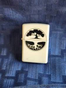 lot 161 image: White Zippo lighter - Living Tree