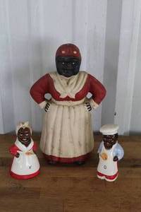 lot 15 image: vintage cast-iron Black Americana figural coin banks depicting the Mammy caricature and two figurines