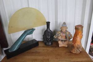 lot 50 image: 1984 Austin Productions sculpture featuring an Art Deco-inspired female face imprinted on a frosted lucite fan and vintage folk art wood carving, and much more see pictures for details