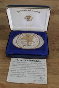 lot 51 image: 24 karat gold vintage Wings of Gold belt buckle from the North American Hunting Club.