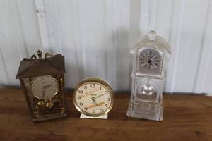 lot 55 image: Schatz London Coach Anniversary ClockGodinger Crystal Legends Mini Grandfather Mantel Clock. And more see pictures