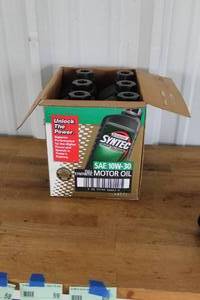 lot 56 image: box of Castrol Syntec SAE 10W-30 full synthetic motor oil