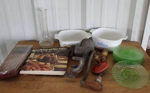 lot 154 image: vintage Heisey glass salad plates and vintage casserole dishs and vintage cast iron item is a collectible meat grinder and much more see pictures for details