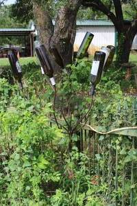 lot 463 image: decorative metal bottle trees used for garden art