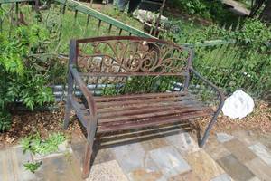 lot 465 image: rustic metal garden bench featuring a decorative cast iron backrest with a scroll or vine pattern