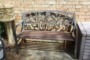 lot 483 image: rustic metal garden bench featuring a decorative cast iron backrest with a scroll or vine pattern