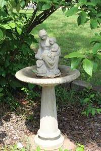 lot 491 image: cast stone or concrete garden fountain featuring a sculpture of a girl and boy